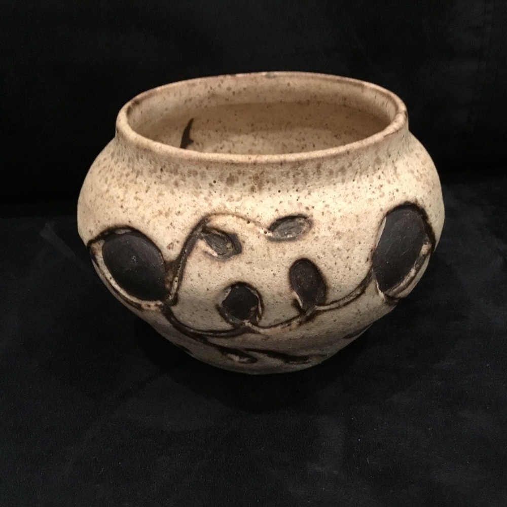 Pottery urn with carved design